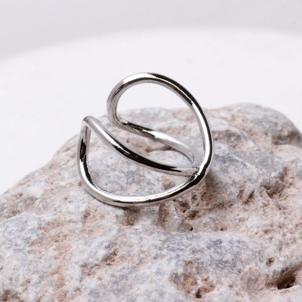 Cross Faker Ear Cuff  on rock background